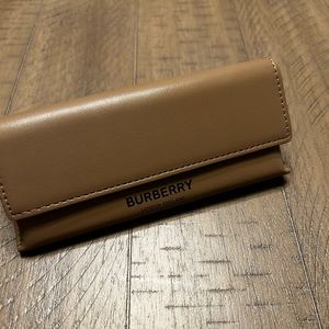 Brand new sunglasses Burberry case. Case never used.  Comes with box